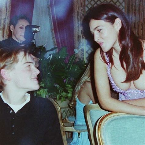 Leonardo DiCaprio and Monica Bellucci at a Versace dinner.